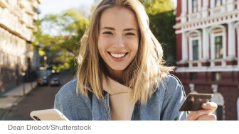 Woman smiles with credit card