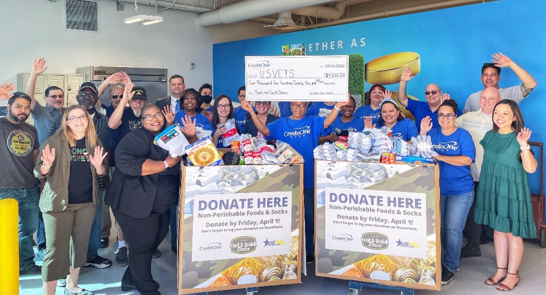 Credit One Bank employees and representatives from U.S.VETS - Las Vegas pose with donations from Bank employees.