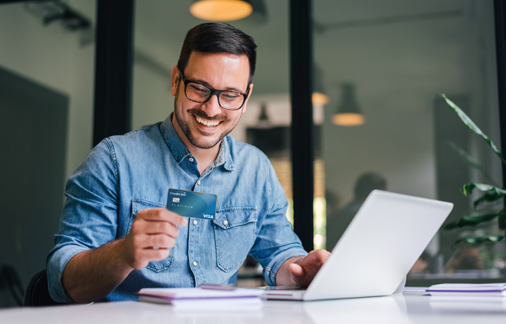 Man Holding a Credit One Card